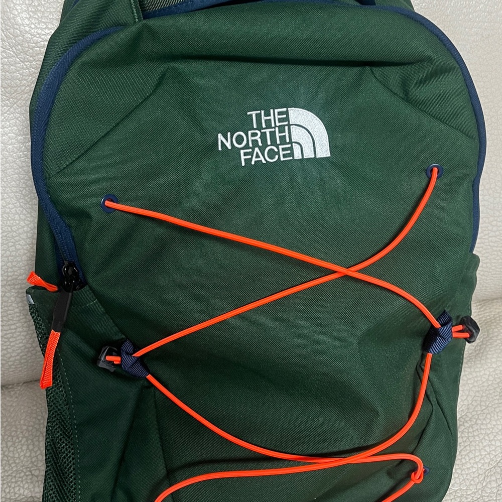 The North Face “jester” Green Backpack with Bright Orange strap